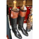 A PAIR OF LEATHER RIDING BOOTS, each with wooden trees (2)