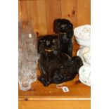 A PAIR OF STAFFORDSHIRE JACKFIELD BLACK SPANIELS, with gilt decoration and glass eyes, approximate
