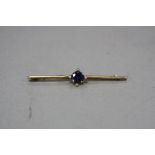 AN EARLY 20TH CENTURY SYNTHETIC SAPPHIRE AND SEED PEARL BAR BROOCH, measuring approximately 62mm