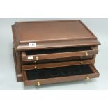 A MODERN MAHOGANY FINISH SET OF FIVE COIN COLLECTORS DRAWERS, side carry handles, width 45cm