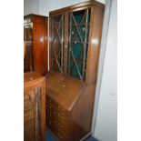 AN OAK BUREAU BOOKCASE (sd) (key)