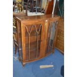 A WALNUT TWO DOOR CHINA CABINET