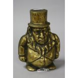 A BRASS 'TRANSVAAL MONEY BOX', Made in England, height approximately 14.5cm