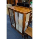 AN OAK GLAZED TWO DOOR CHINA CABINET