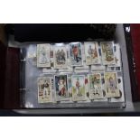 AN ALBUM OF CIGARETTE CARDS, to include Player's 'Gilbert & Sullivan', 'War Decorations &