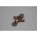 A MODERN GLASS FILLED RUBY AND DIAMOND ORNATE CROSS PENDANT, measuring approximately 50mm x 31mm,