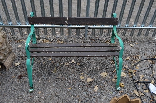 A PAINTED WROUGHT IRON GARDEN BENCH, with scroll detail and wooden slats, approximate length 120cm