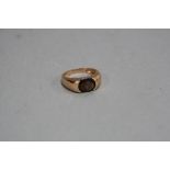 A MODERN 9CT GOLD SINGLE STONE SMOKY QUARTZ RING, oval faceted smoky quartz measuring