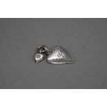 A LATE 20TH CENTURY SILVER PENDANT, comprising of two heart pendants, one engraved 'hope',