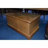 A PINE BLANKET CHEST, with central painted detail to lid