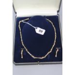 A MODERN 9CT GOLD FANCY LINK CHAIN AND MATCHING EARRING SET, trombone and knot link, chain measuring