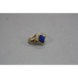 A MODERN 9CT GOLD, LAPIS LAZULI, AMETHYST AND DIAMOND RING, estimated total diamond weight 0.20ct,