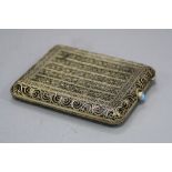 A SILVER GILT FILIGREE CIGARETTE CASE, with a turquoise thumb piece