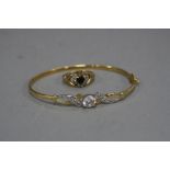 A 9CT BANGLE, together with a 9ct dress ring, ring size O