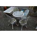 A PAINTED CAST ALUMINUM GARDEN TABLE, and four chairs, with pierced fretwork designs (5)