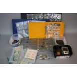 A BOX CONTAINING COIN ALBUMS, LOOSE COINS AND BANKNOTES, to include four albums with mostly silver