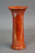 A RUSKIN POTTERY CYLINDRICAL VASE, with flared rim, orange lustre glazed, impressed marks Ruskin,