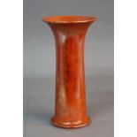 A RUSKIN POTTERY CYLINDRICAL VASE, with flared rim, orange lustre glazed, impressed marks Ruskin,