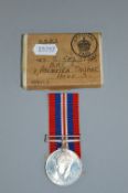 A BOXED WWII WAR MEDAL, with ribbon, box addressed to Mrs S Gelston, Flat 5, 11, Palmeira Sq, Hove