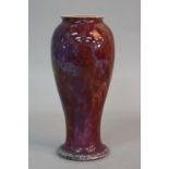 A RUSKIN POTTERY BALUSTER VASE, with flared foot, blue speckled red flambe glaze, impressed Ruskin