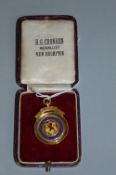 A 9CT GOLD SCOTTISH FOOTBALL MEDAL, awarded to W. Quinn of Celtic F.C. For Scottish 2nd XI