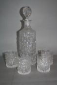A WHITEFRIARS GLACIER RANGE CYLINDRICAL DECANTER WITH STOPPER, together with a set of four