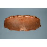 AN ARTS & CRAFTS STYLE OVAL COPPER TRAY, wavy edge surrounding a stamped design of two fish,