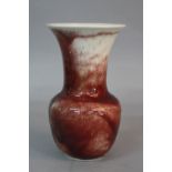 A RUSKIN POTTERY BALUSTER VASE, with flared rim, red on ivory flambe glaze, impressed Ruskin England