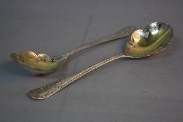 A PAIR OF VICTORIAN SILVER FRUIT SPOONS, gilt bowls engraved with fruiting vine, the handles