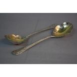 A PAIR OF VICTORIAN SILVER FRUIT SPOONS, gilt bowls engraved with fruiting vine, the handles