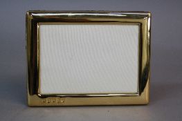 AN ELIZABETH II SILVER GILT RECTANGULAR PHOTOGRAPH FRAME, maker RC, Sheffield 2002, inner