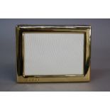 AN ELIZABETH II SILVER GILT RECTANGULAR PHOTOGRAPH FRAME, maker RC, Sheffield 2002, inner