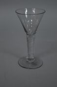 A GEORGE III WINE GLASS, trumpet shaped bowl, clear air twist stem, height approximately 16cm