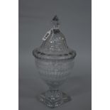 A LATE GEORGIAN CUT GLASS URN SHAPED PEDESTAL BOWL AND COVER, the domed cover with facet cut