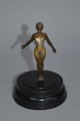 AN ART DECO DESMO CAR MASCOT, in the form of a female nude, arching backwards with arms outstretched
