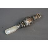 A GEORGE VI SILVER AND MOTHER OF PEARL BABY'S RATTLE, in the form of Peter Rabbit, makers mark for