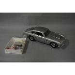 AN EAGLEMOSS JAMES BOND ASTON MARTIN D.B.5, heavy, well built 1;8 scale model constructed with parts