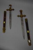 TWO GEORGE VI BANDSMANS SHORT SWORDS IN SCABBARDS, total length 50cm, the handles are possibly alloy