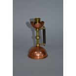 AN ARTS & CRAFTS COPPER AND BRASS CHAMBERSTICK, after Christopher Dresser, petal shaped sconce,