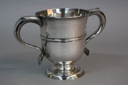 A GEORGE II SILVER LOVING CUP, twin 'S' scroll handles, circular body with single band, circular