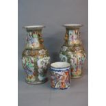 A PAIR OF 19TH CENTURY CHINESE PORCELAIN FAMILLE ROSE BALUSTER VASES, frilled rims, the bodies