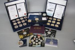 A SMALL COIN COLLECTION, containing two Westminster boxes of The Titanic gold plated collection,