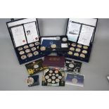 A SMALL COIN COLLECTION, containing two Westminster boxes of The Titanic gold plated collection,