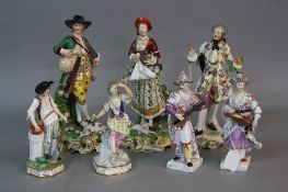SEVEN 19TH CENTURY CONTINENTAL PORCELAIN FIGURES OF LADIES AND GENTLEMAN, the largest pair bearing