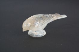 A RENE LALIQUE CHARDONNERET TIMIDE CLEAR AND FROSTED GLASS PAPERWEIGHT, traces of a brown/red stain,