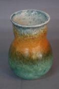 A RUSKIN POTTERY VASE, of baluster form with flared rim, banded mottled matt glazes in shades of