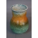 A RUSKIN POTTERY VASE, of baluster form with flared rim, banded mottled matt glazes in shades of