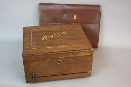 A LATE 19TH CENTURY WALNUT CASED SYMPHONIUM, inlaid lettering to the lid, the interior with