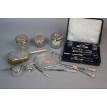 A GROUP LOT OF SILVER TOPPED GLASS DRESSING TABLE JARS, cased and loose manicure accessories, silver