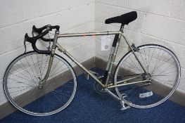 A GENTS RALEIGH ROAD BIKE, bears labels 'Assembled using misc parts avail, soiled !...' and 'Your